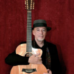 Michael Phillips with his Taylor 12-string guitar